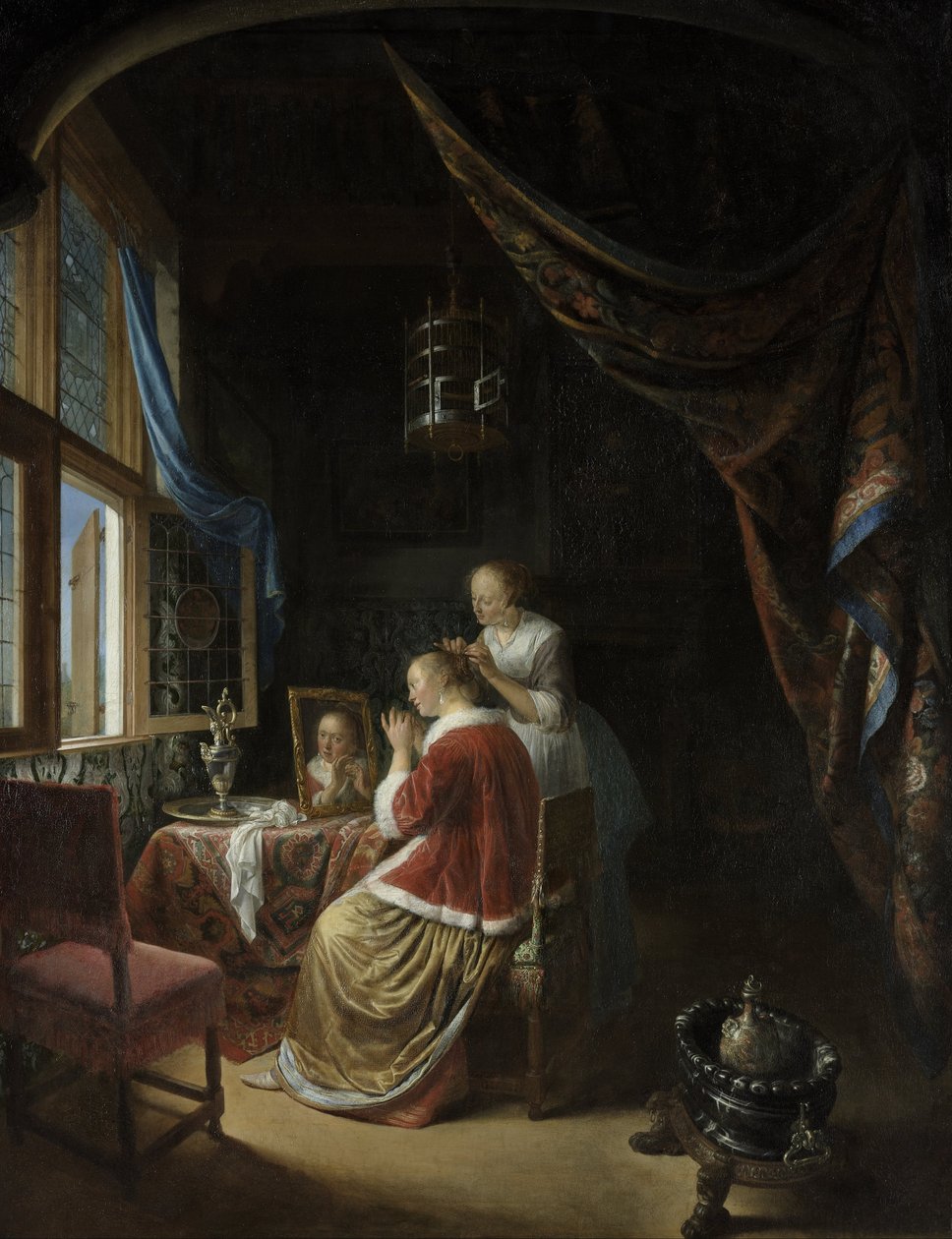 Eine junge Frau bei ihrer Toilette von Gerrit Dou