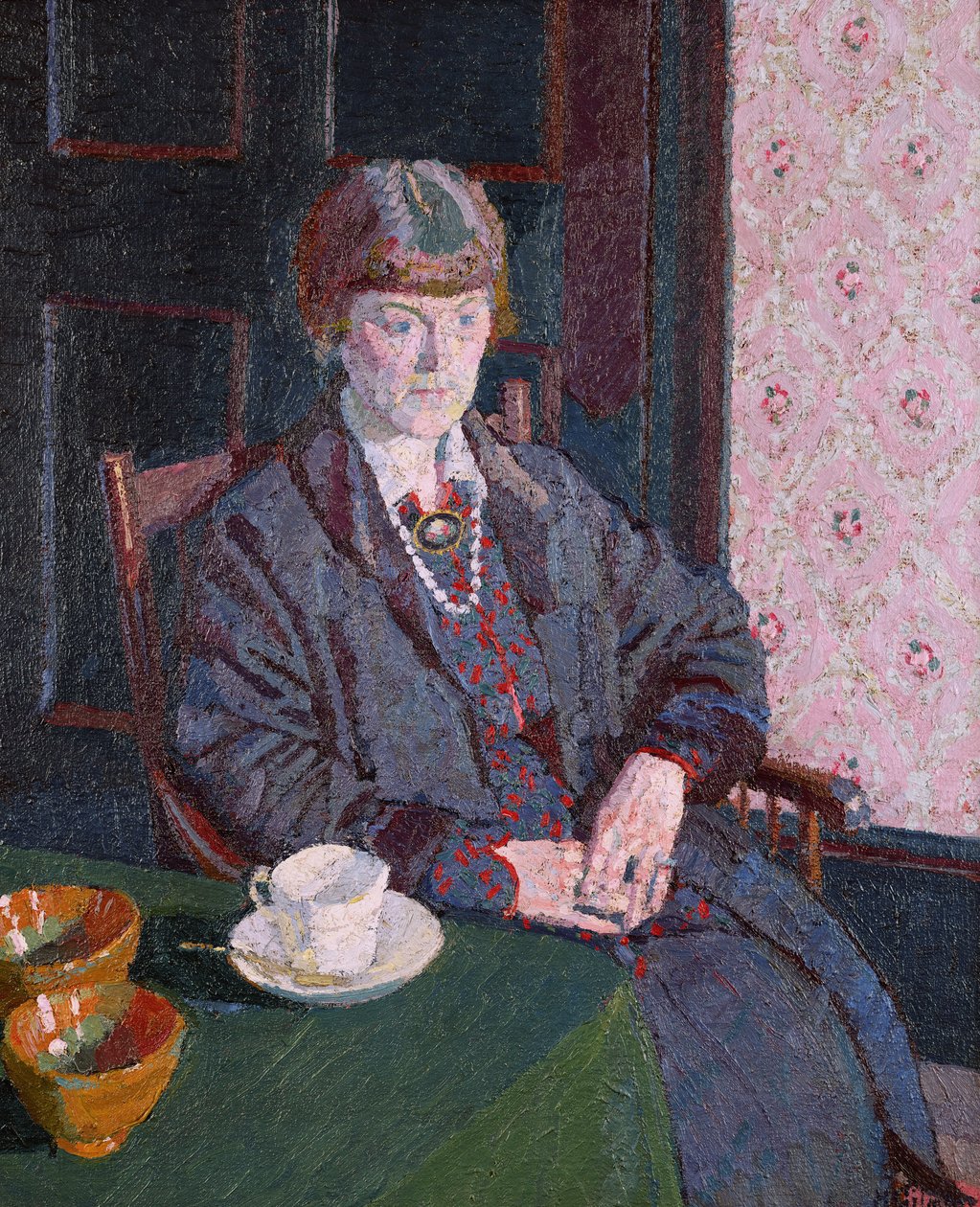 Frau, die an einem Tisch sitzt von Harold Gilman