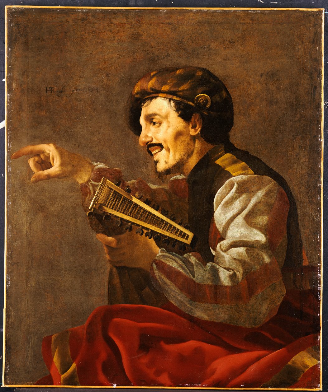 Ein sitzender Lautenspieler zeigt von Hendrick ter Brugghen