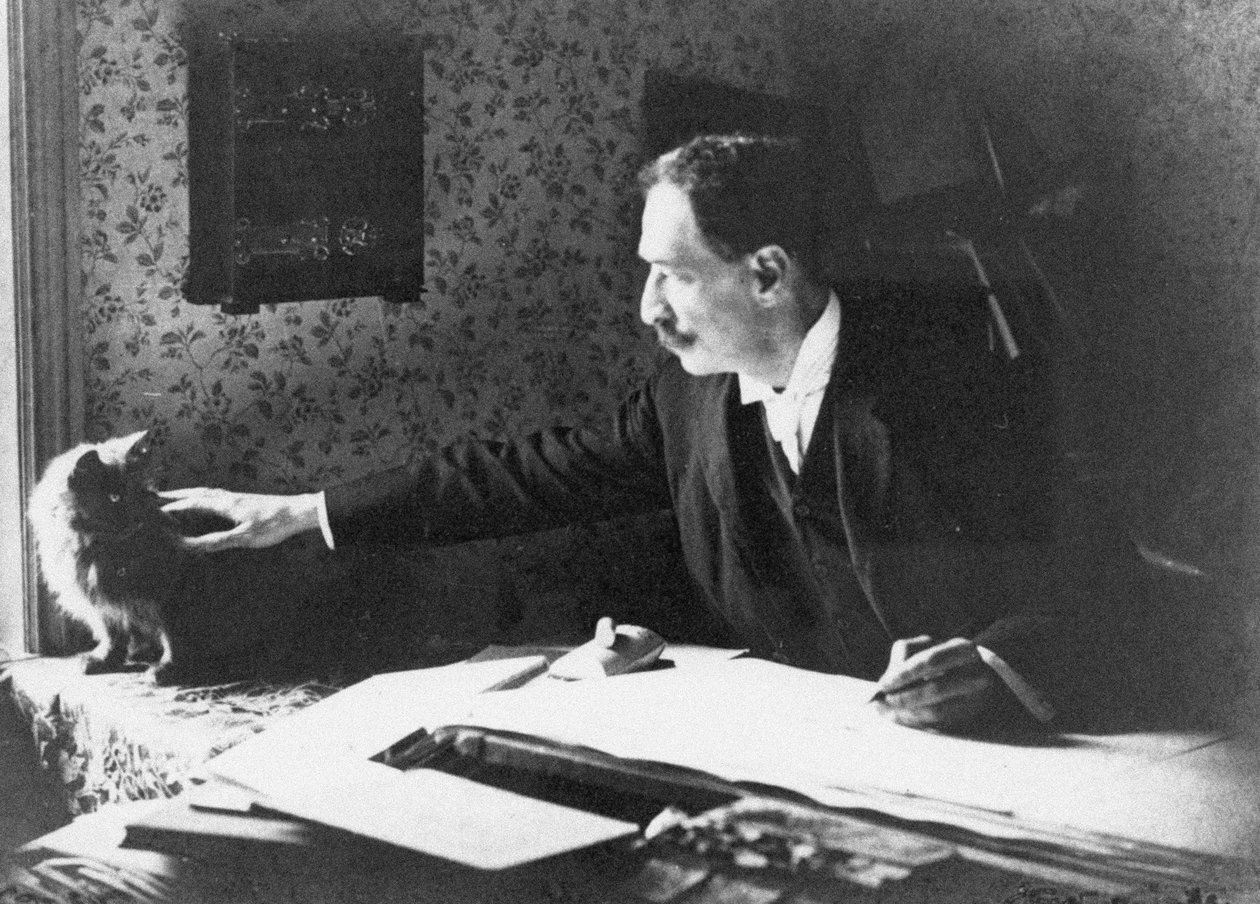 Louis Wain an seinem Zeichentisch, 1890er Jahre von Unbekannt