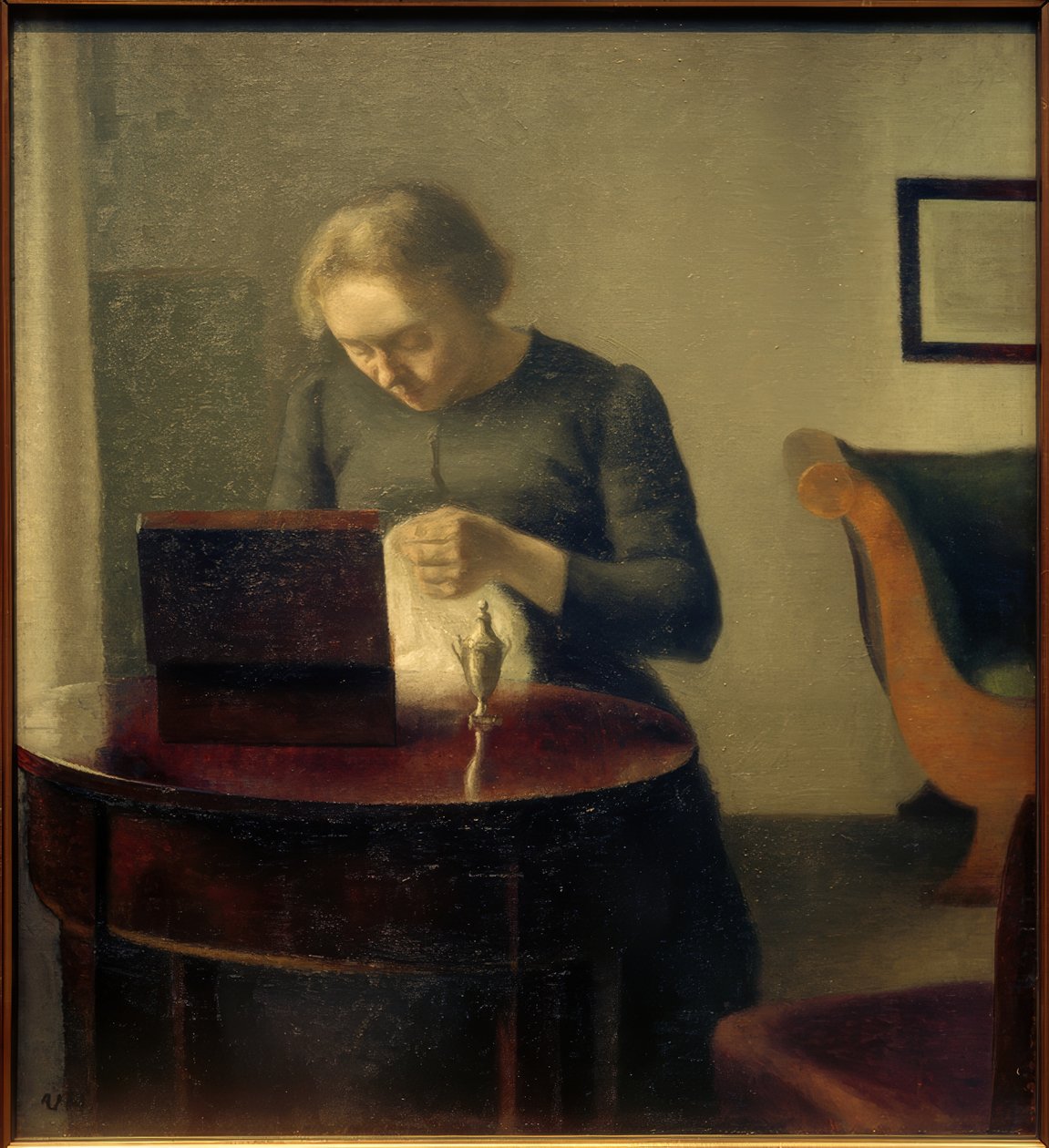 Frau des Künstlers am Nähtisch von Vilhelm Hammershoi